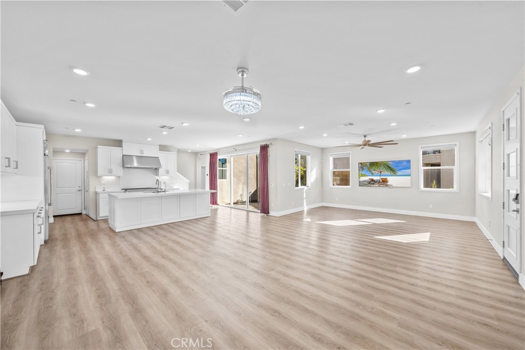 124 Zawn Irvine, CA 92618 - Photo 7 of 56 a view of a kitchen with kitchen island a hard wood floor