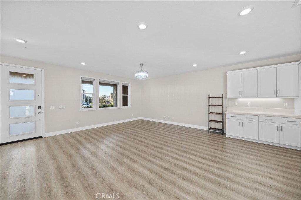 124 Zawn Irvine, CA 92618 - Photo 10 of 56 an empty room with wooden floor and window