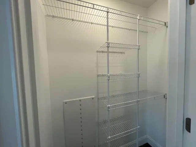 a bathroom with a glass shower door