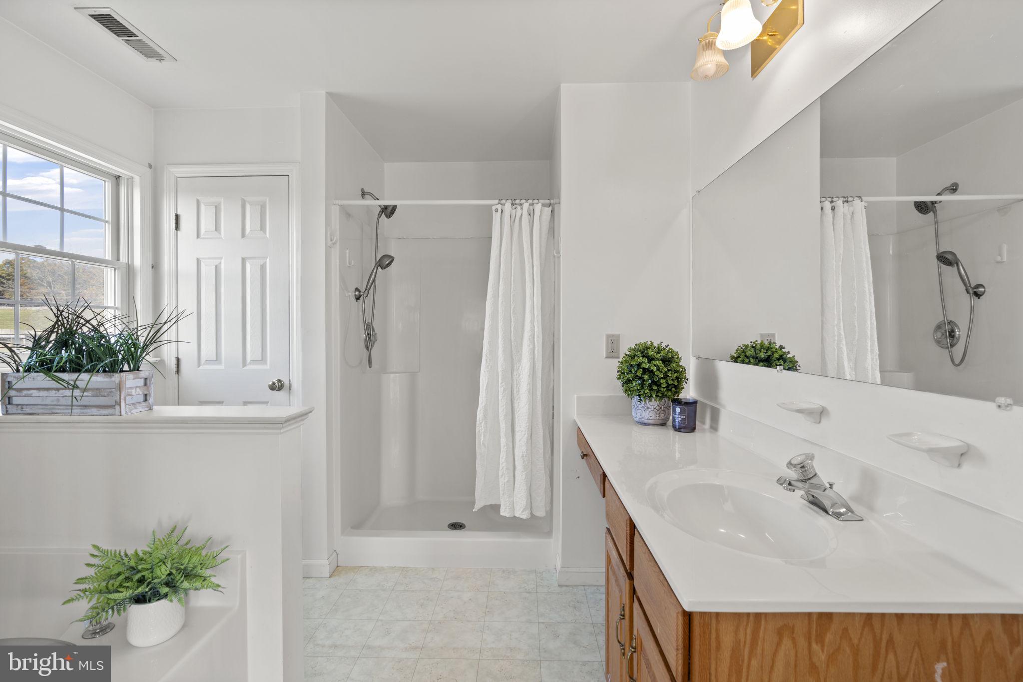 5715 Emory Road Upperco, MD 21155 - Photo 14 of 43 a bathroom with a granite countertop sink and a mirror
