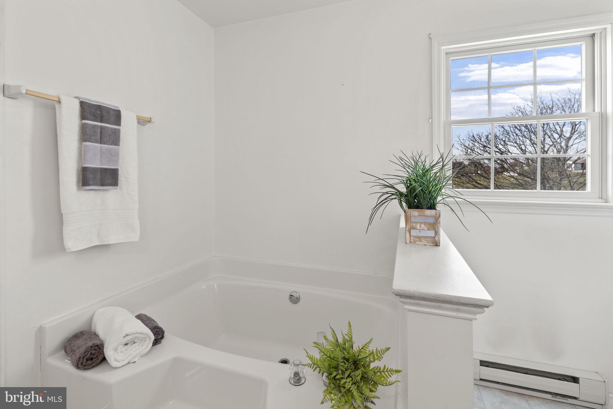 5715 Emory Road Upperco, MD 21155 - Photo 16 of 43 a white bath tub sitting next to a window