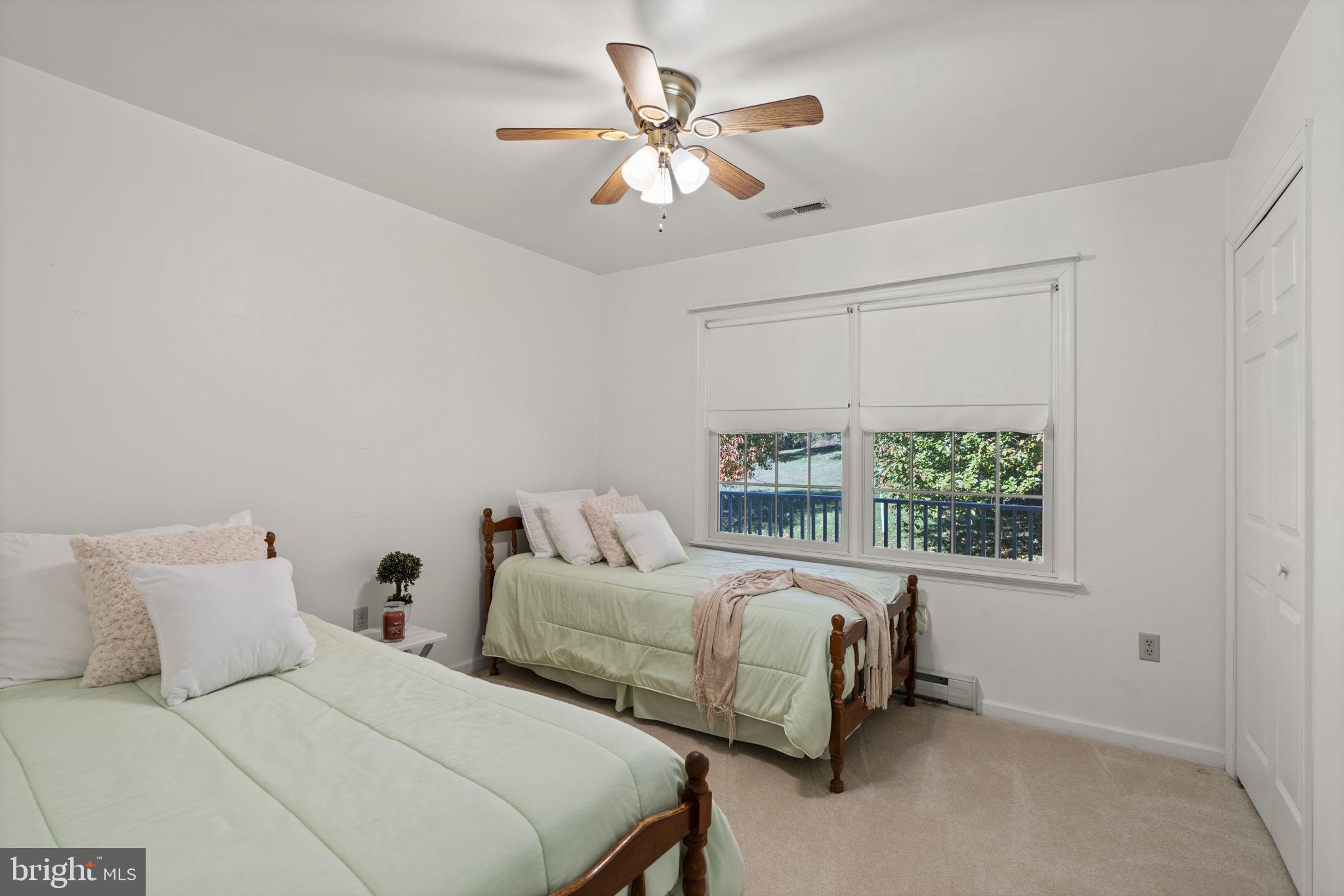 5715 Emory Road Upperco, MD 21155 - Photo 19 of 43 a bedroom with a bed and a large window