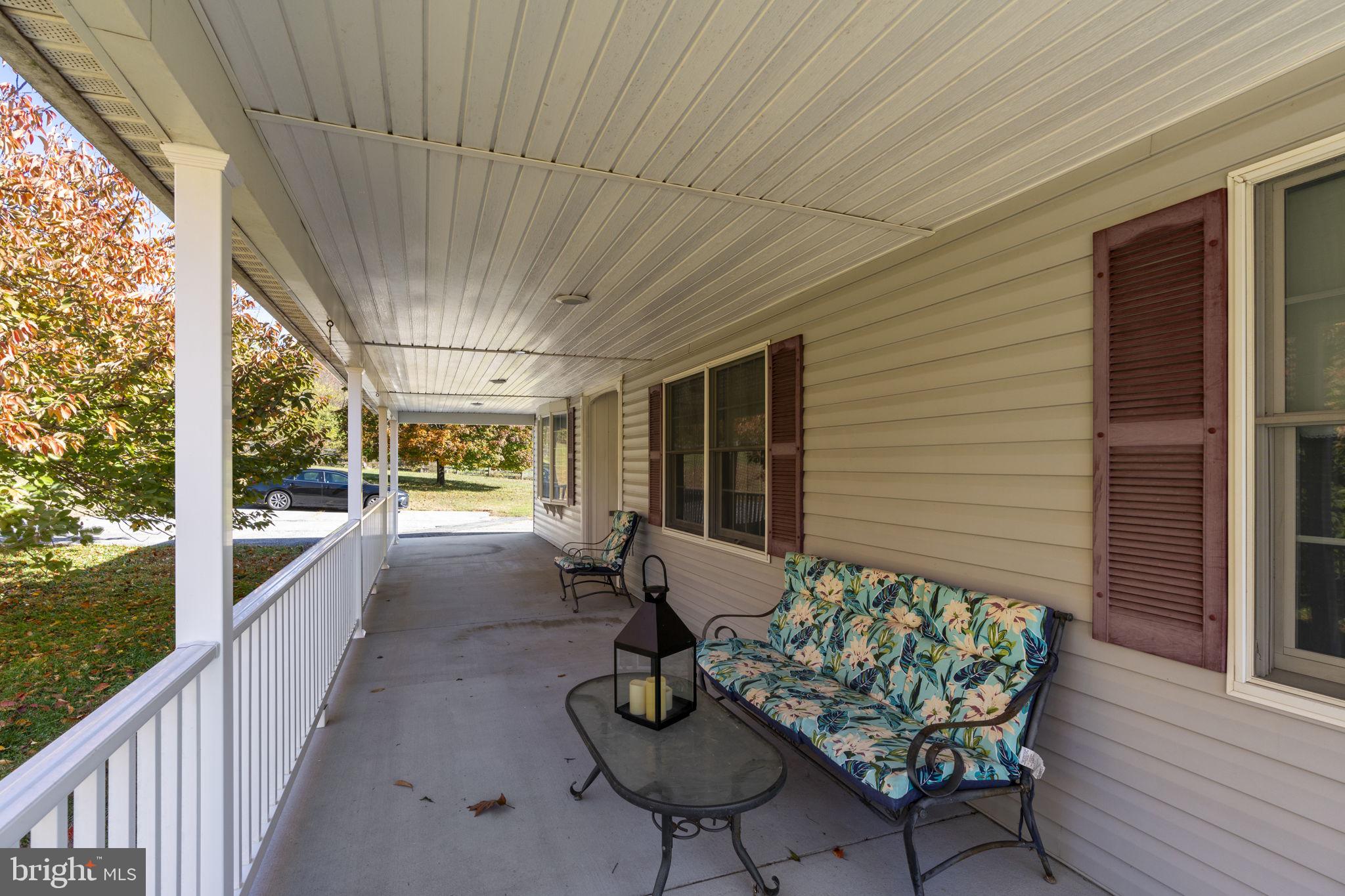 5715 Emory Road Upperco, MD 21155 - Photo 27 of 43 a balcony with furniture and a potted plant