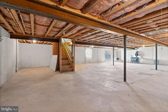 a view of a room with wooden stairs