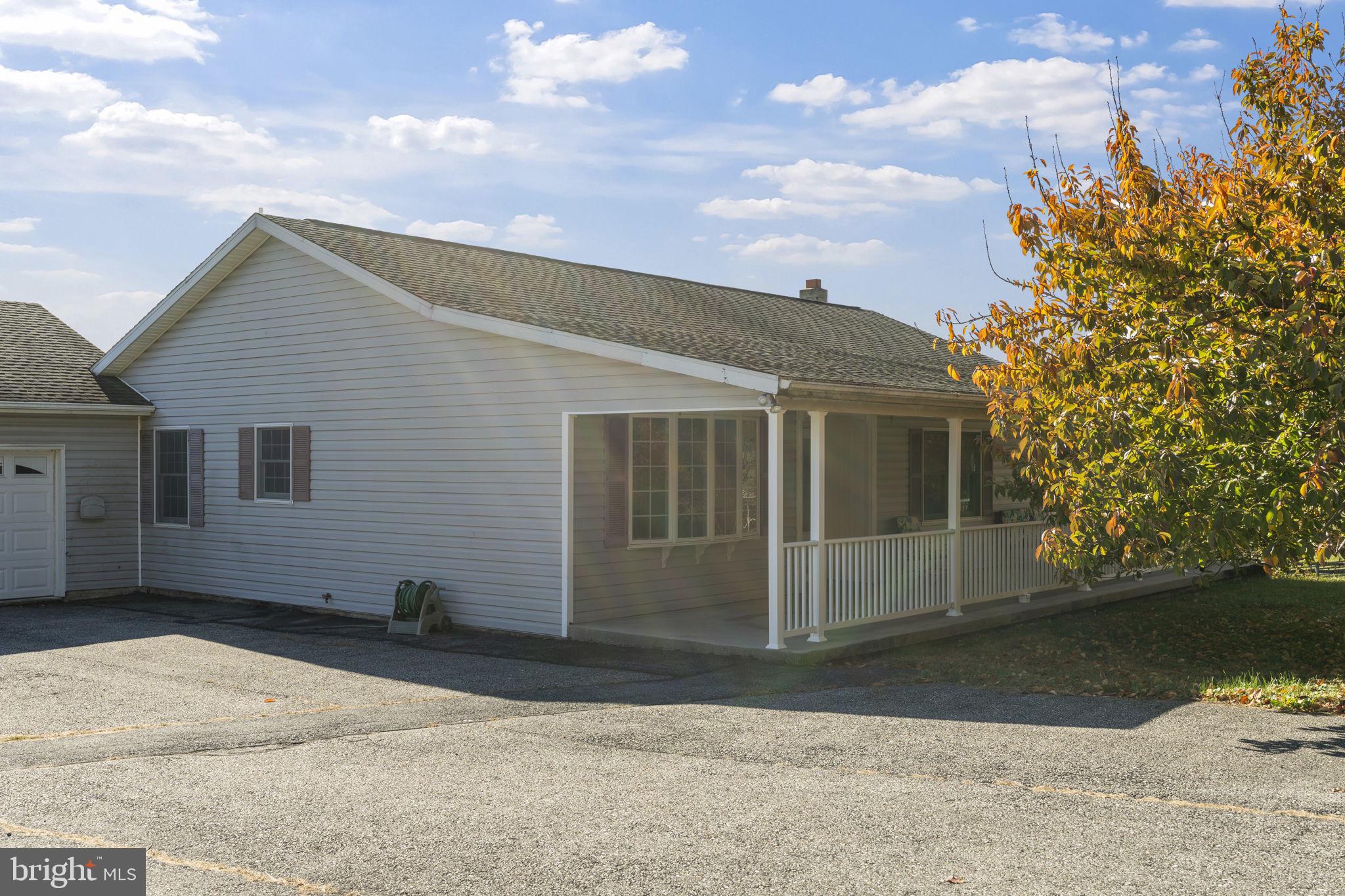 5715 Emory Road Upperco, MD 21155 - Photo 39 of 43 a front view of a house with a yard and garage