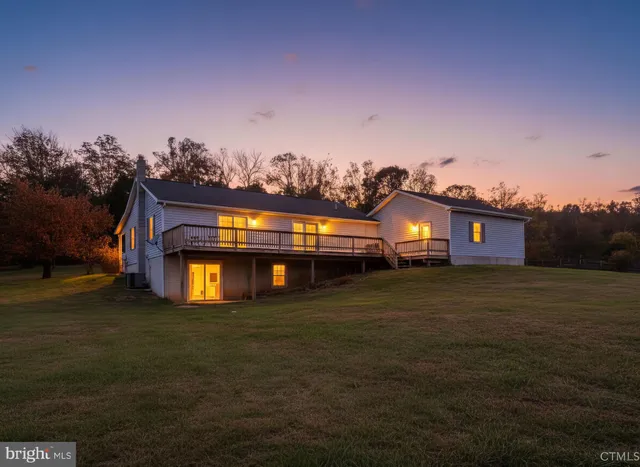 a front view of a house with a big yard