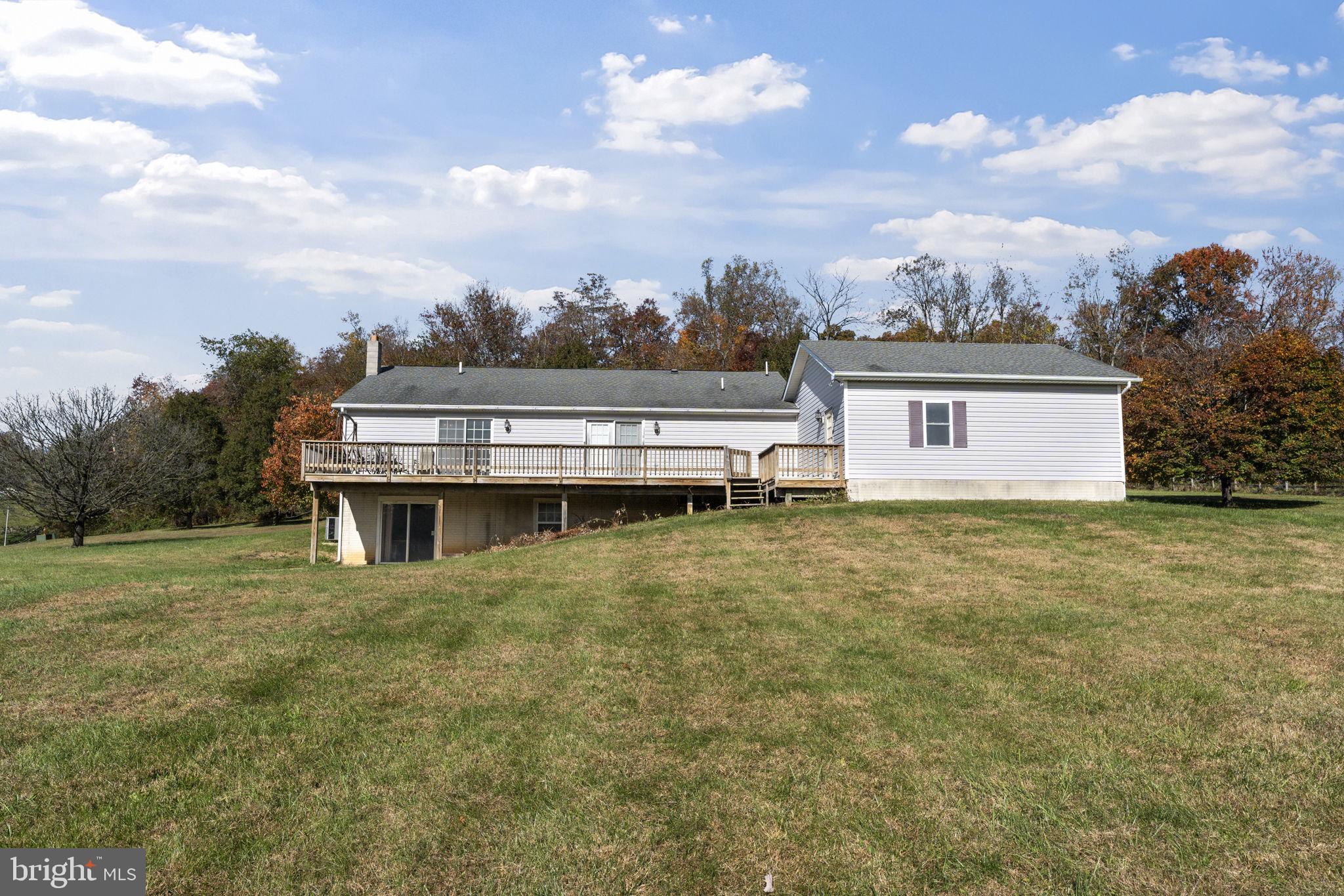 5715 Emory Road Upperco, MD 21155 - Photo 42 of 43 a backyard of a house with table and chairs