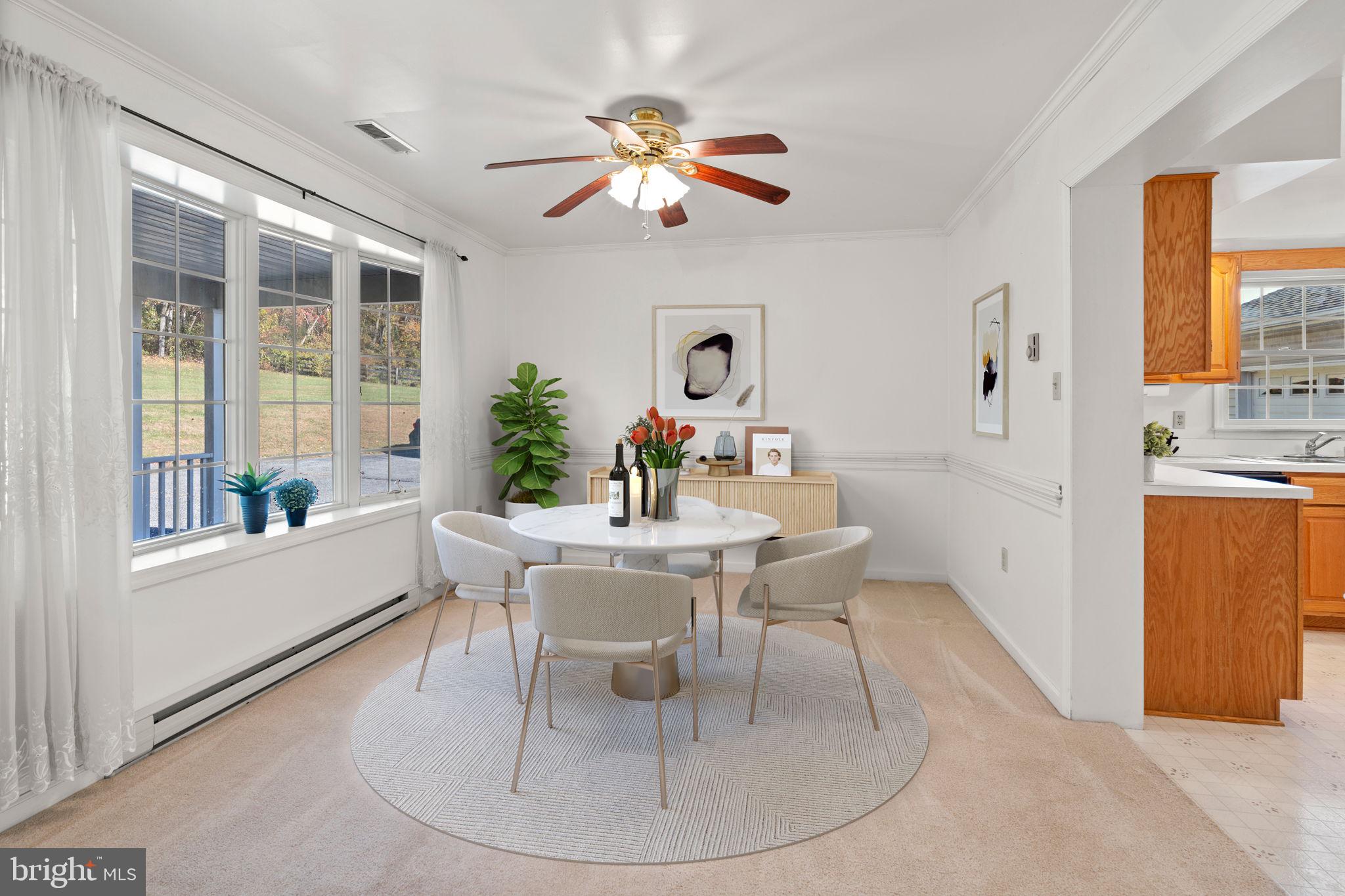 5715 Emory Road Upperco, MD 21155 - Photo 8 of 43 a dining room with furniture a window and a chandelier
