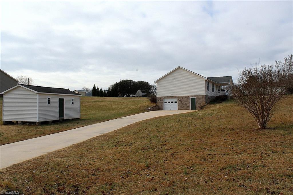 152 Quail Ridge Drive Lexington, NC 27292 - Photo 23 of 25 Side view and storage building