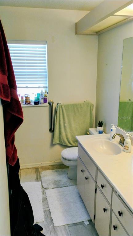 11591 Southwest 78th Avenue Ocala, FL 34476 - Photo 13 of 23 a bathroom with a sink and a mirror