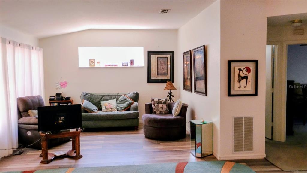 11591 Southwest 78th Avenue Ocala, FL 34476 - Photo 3 of 23 a living room with furniture and a window