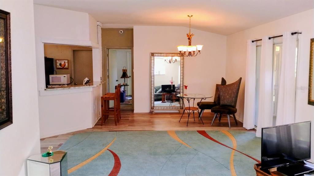 11591 Southwest 78th Avenue Ocala, FL 34476 - Photo 4 of 23 a view of a livingroom with furniture and a piano