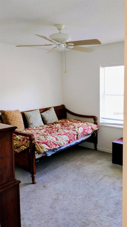 11591 Southwest 78th Avenue Ocala, FL 34476 - Photo 6 of 23 a bedroom with a bed and a window