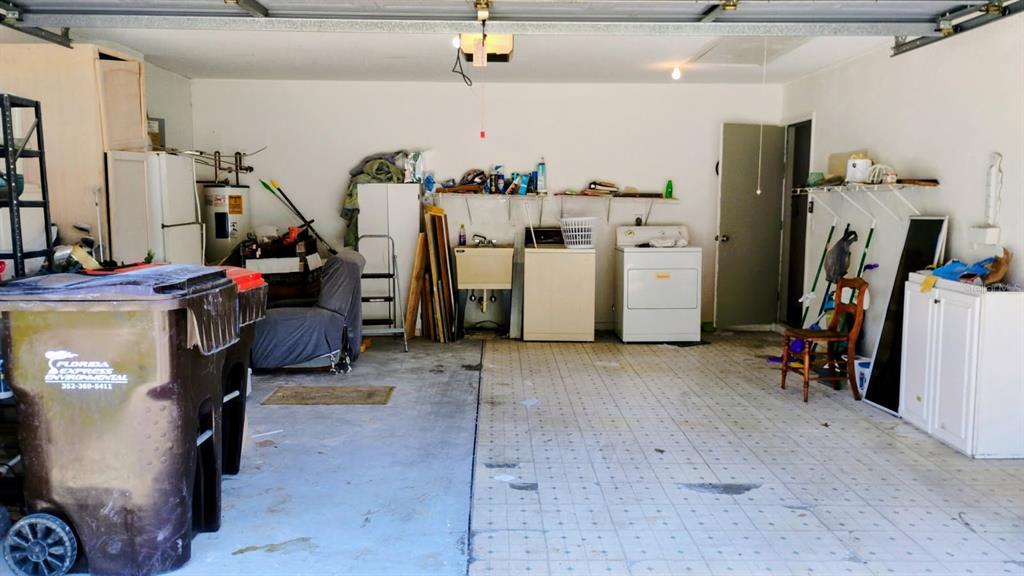 11591 Southwest 78th Avenue Ocala, FL 34476 - Photo 10 of 23 a view of a storage room with water heater and storage