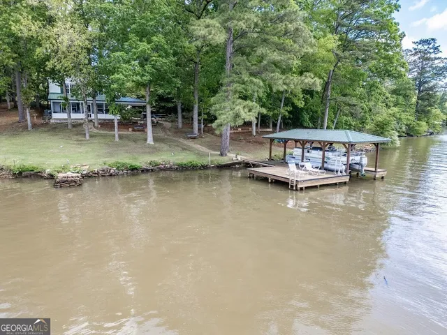 a view of a house with outdoor space and garden
