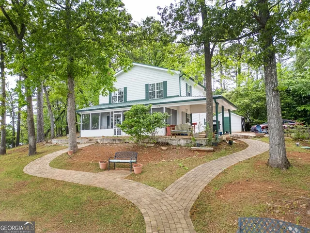 a house with trees in the background