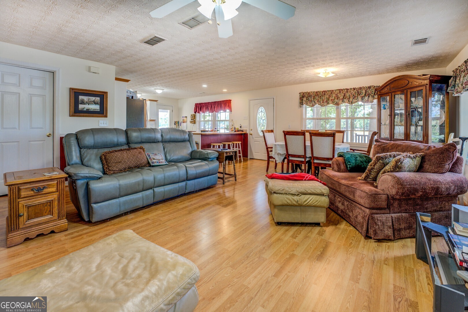 2000 Campbell Road Covington, GA 30014 - Photo 28 of 80 a living room with furniture and a wooden floor
