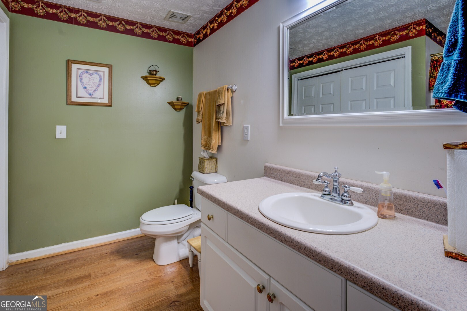 2000 Campbell Road Covington, GA 30014 - Photo 34 of 80 a bathroom with a sink toilet and a mirror