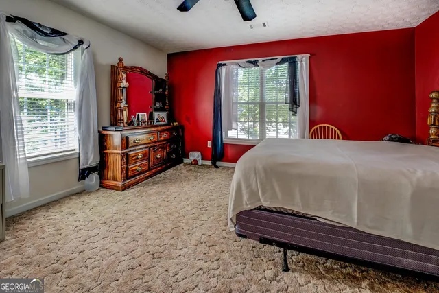 a view of a lake with houses in the back