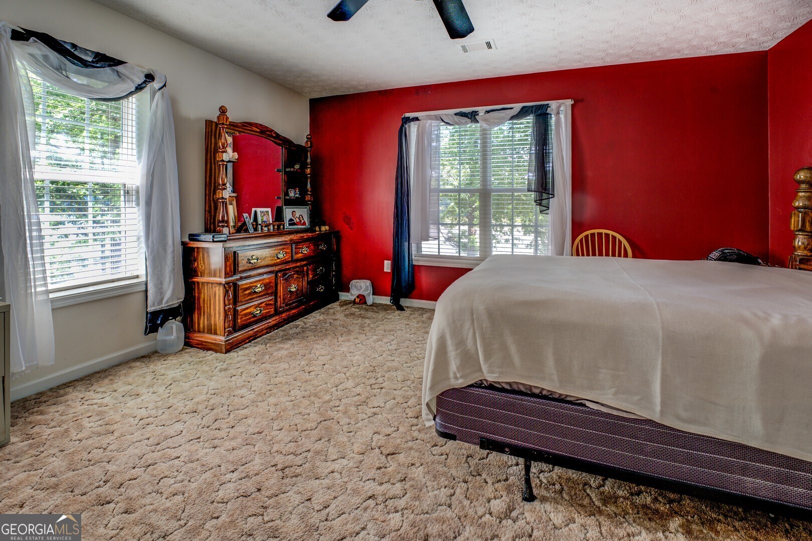 2000 Campbell Road Covington, GA 30014 - Photo 44 of 80 a bed sitting in a room next to a window
