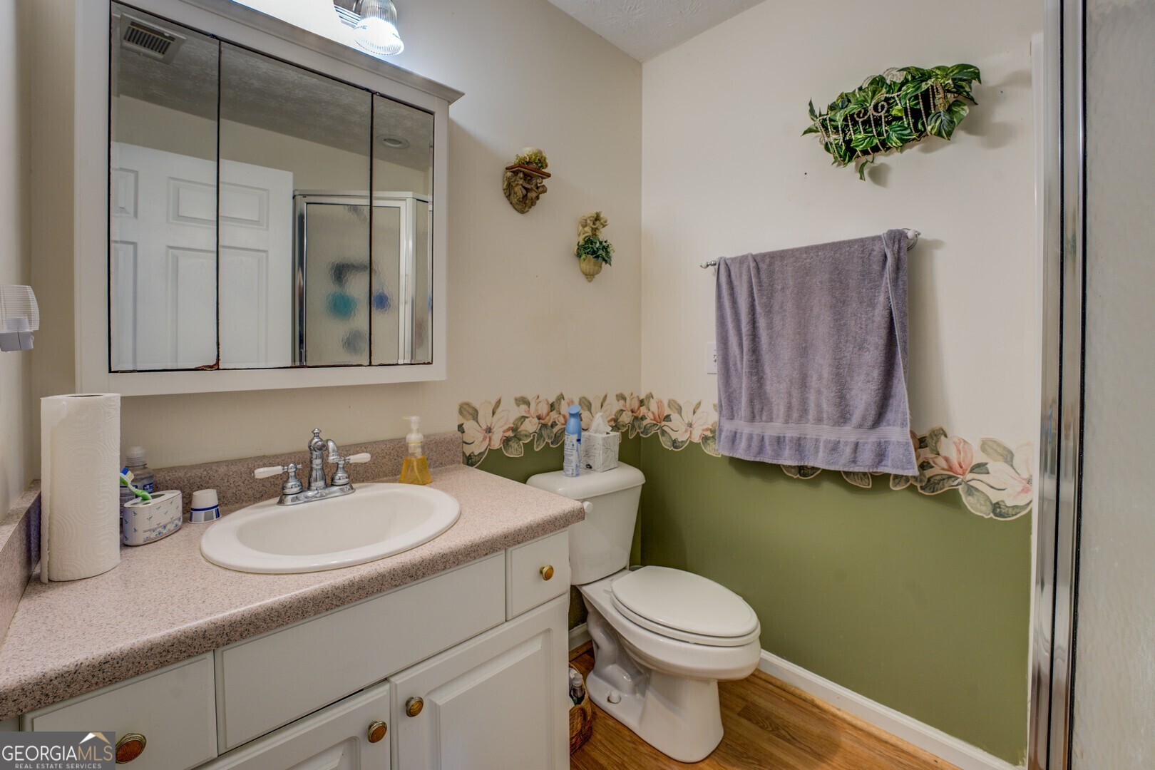2000 Campbell Road Covington, GA 30014 - Photo 47 of 80 a bathroom with a toilet sink and mirror