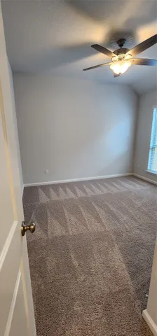 a view of empty room with windows