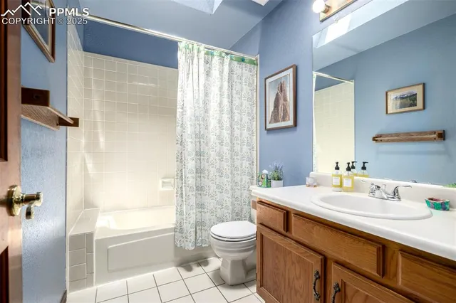 a bed room with a bed and a chandelier