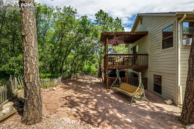 a view of a house with a wooden deck