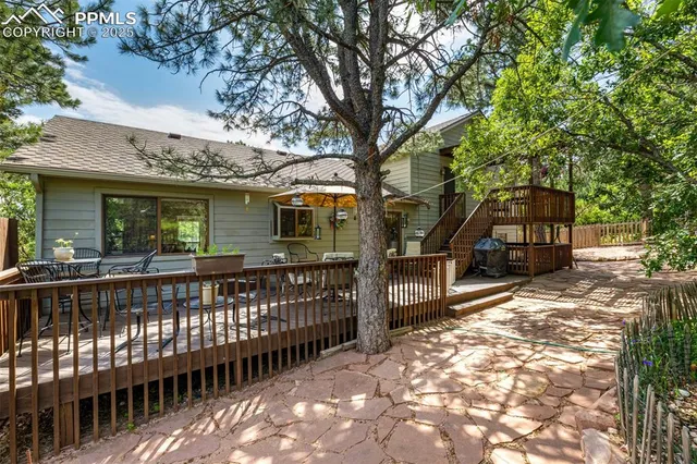 a view of a two chairs and table in the balcony