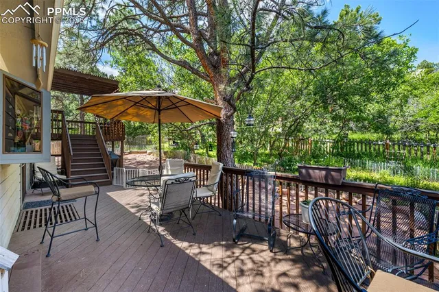 a view of a two chairs in the balcony