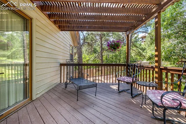 a view of a chairs and table in the balcony