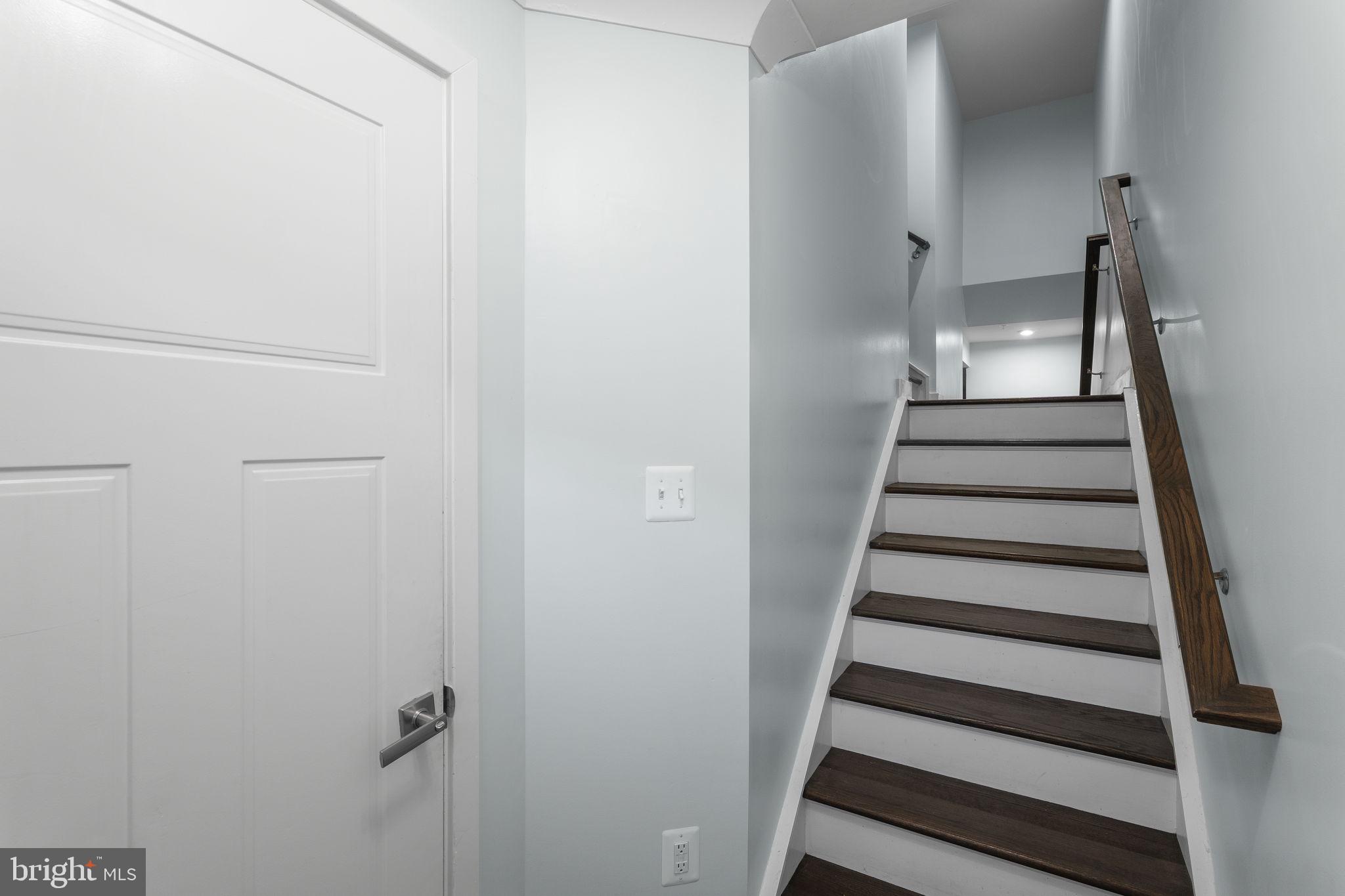 2904 Shaws Road Sparrows Point, MD 21219 - Photo 12 of 44 Switchback staircase up to main level & down to FR