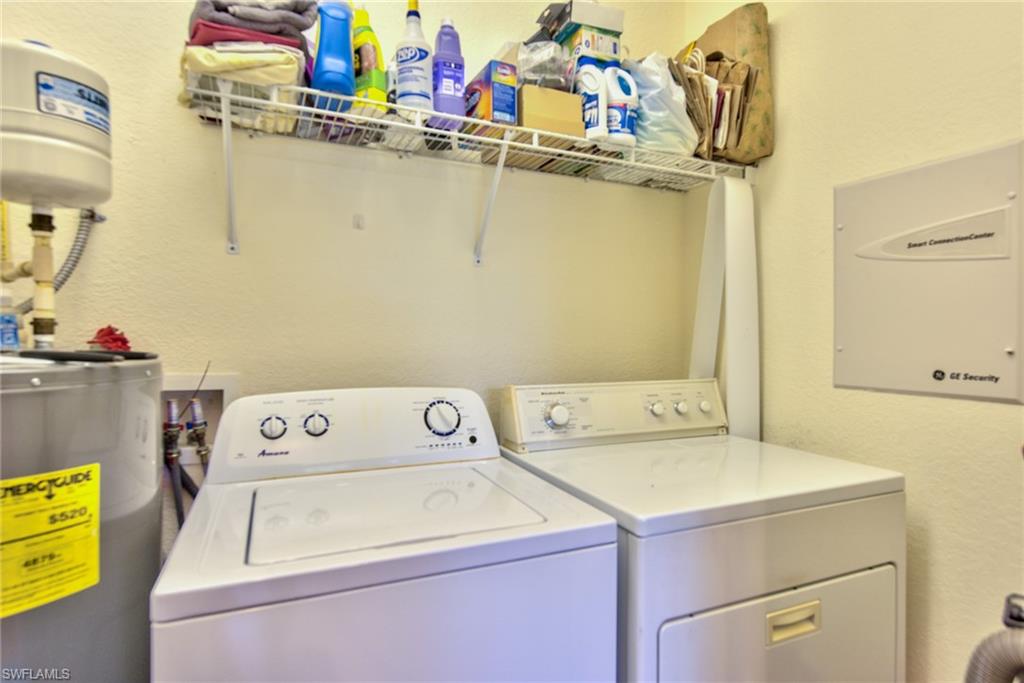 12859 Carrington Circle, Unit 3202 Naples, FL 34105 - Photo 13 of 28 a utility room with dryer and washer