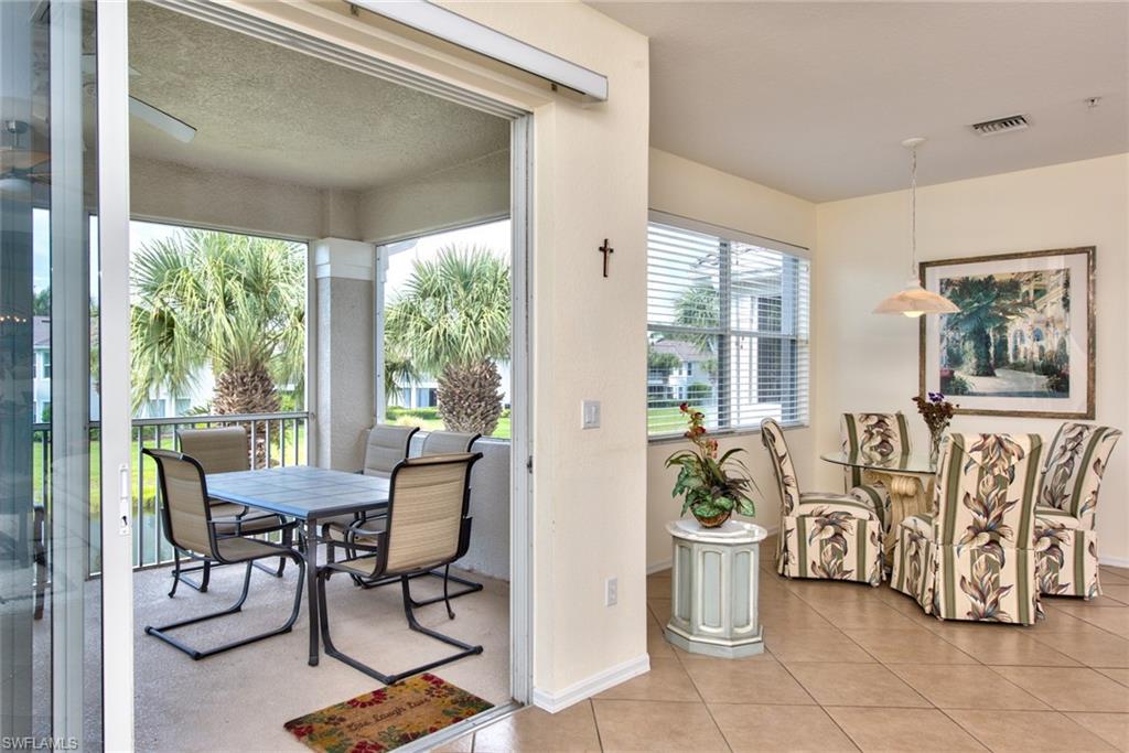 12859 Carrington Circle, Unit 3202 Naples, FL 34105 - Photo 14 of 28 a view of a dining room with furniture window and outside view