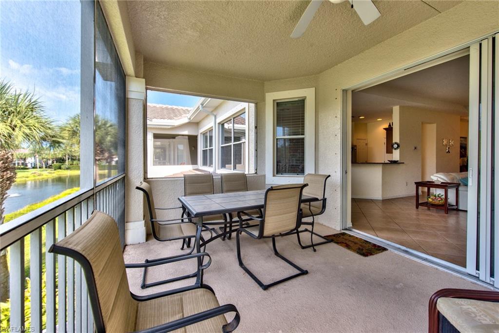 12859 Carrington Circle, Unit 3202 Naples, FL 34105 - Photo 16 of 28 a view of a livingroom with furniture and wooden floor