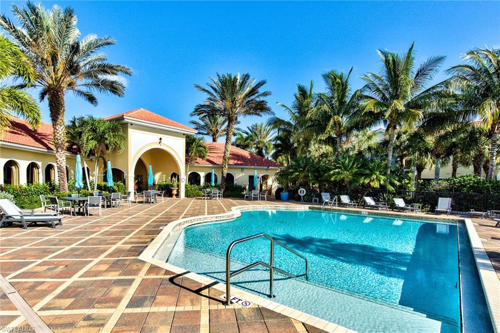 12859 Carrington Circle, Unit 3202 Naples, FL 34105 - Photo 24 of 28 a view of a house with swimming pool and sitting area