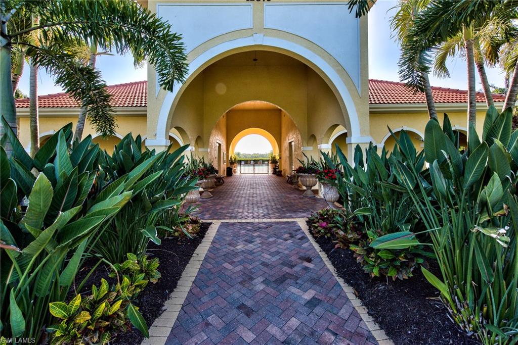 12859 Carrington Circle, Unit 3202 Naples, FL 34105 - Photo 28 of 28 a view of a garden with a fountain