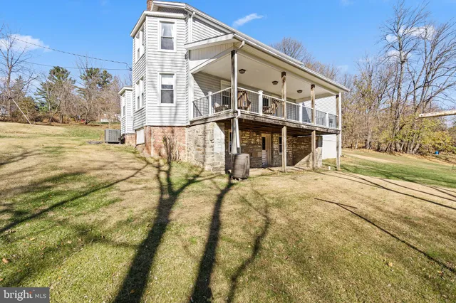 a kitchen with sink cabinets and wooden floor