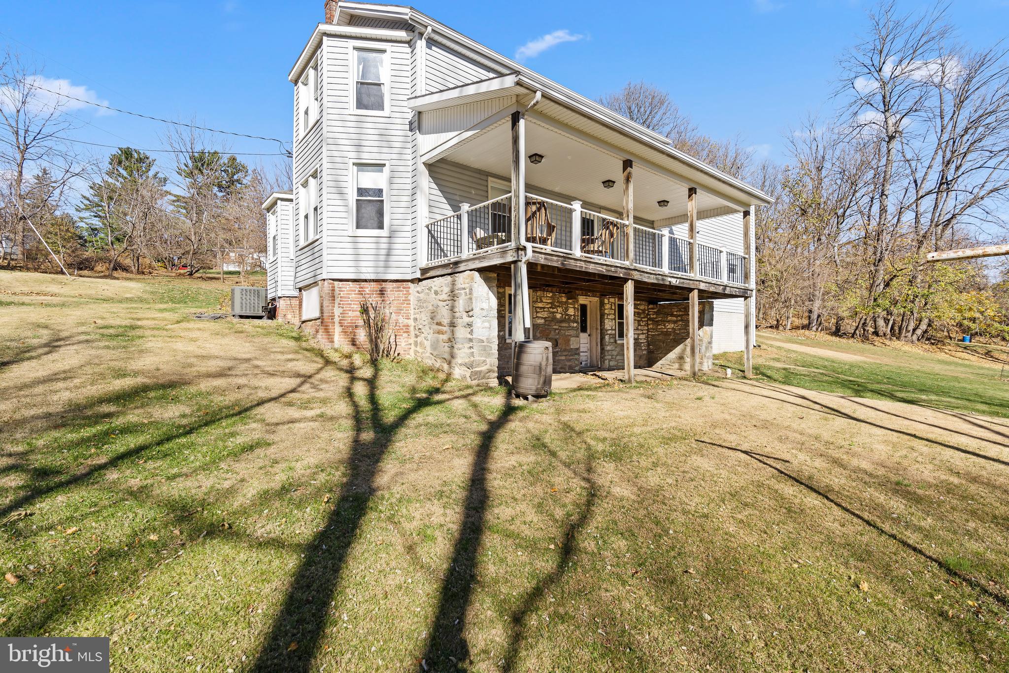 13608 Maryland Avenue Blue Ridge Summit, PA 17214 - Photo 11 of 80 a front view of a house with a yard