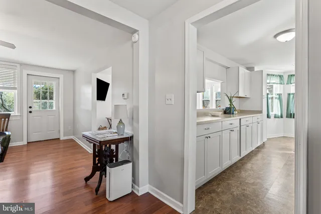a kitchen with stainless steel appliances a stove microwave and refrigerator