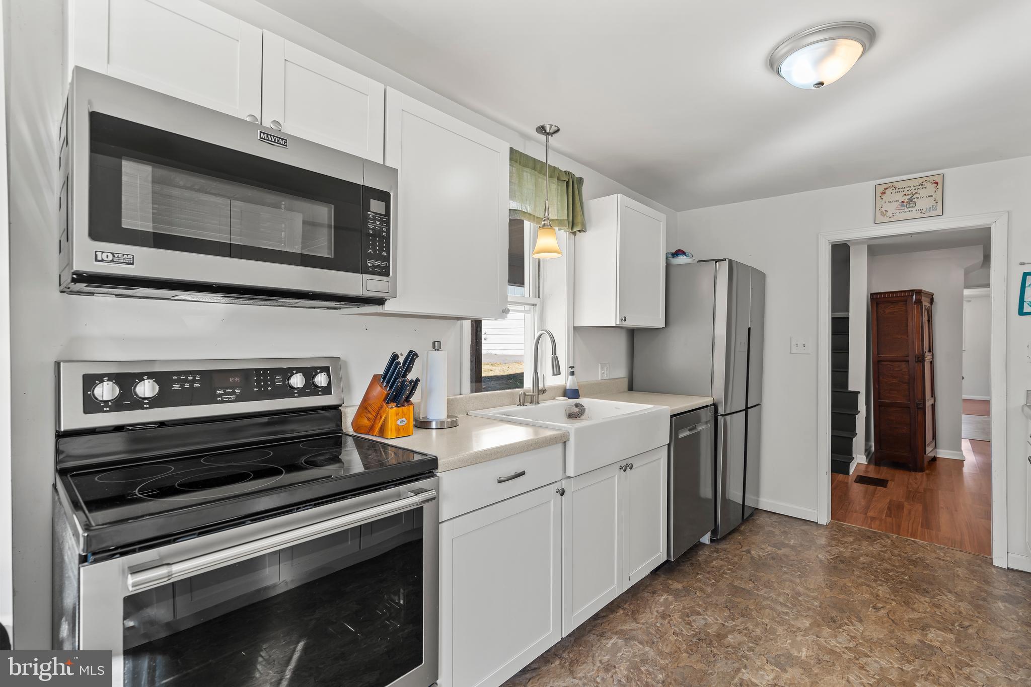 13608 Maryland Avenue Blue Ridge Summit, PA 17214 - Photo 18 of 80 a kitchen with stainless steel appliances a stove microwave and refrigerator