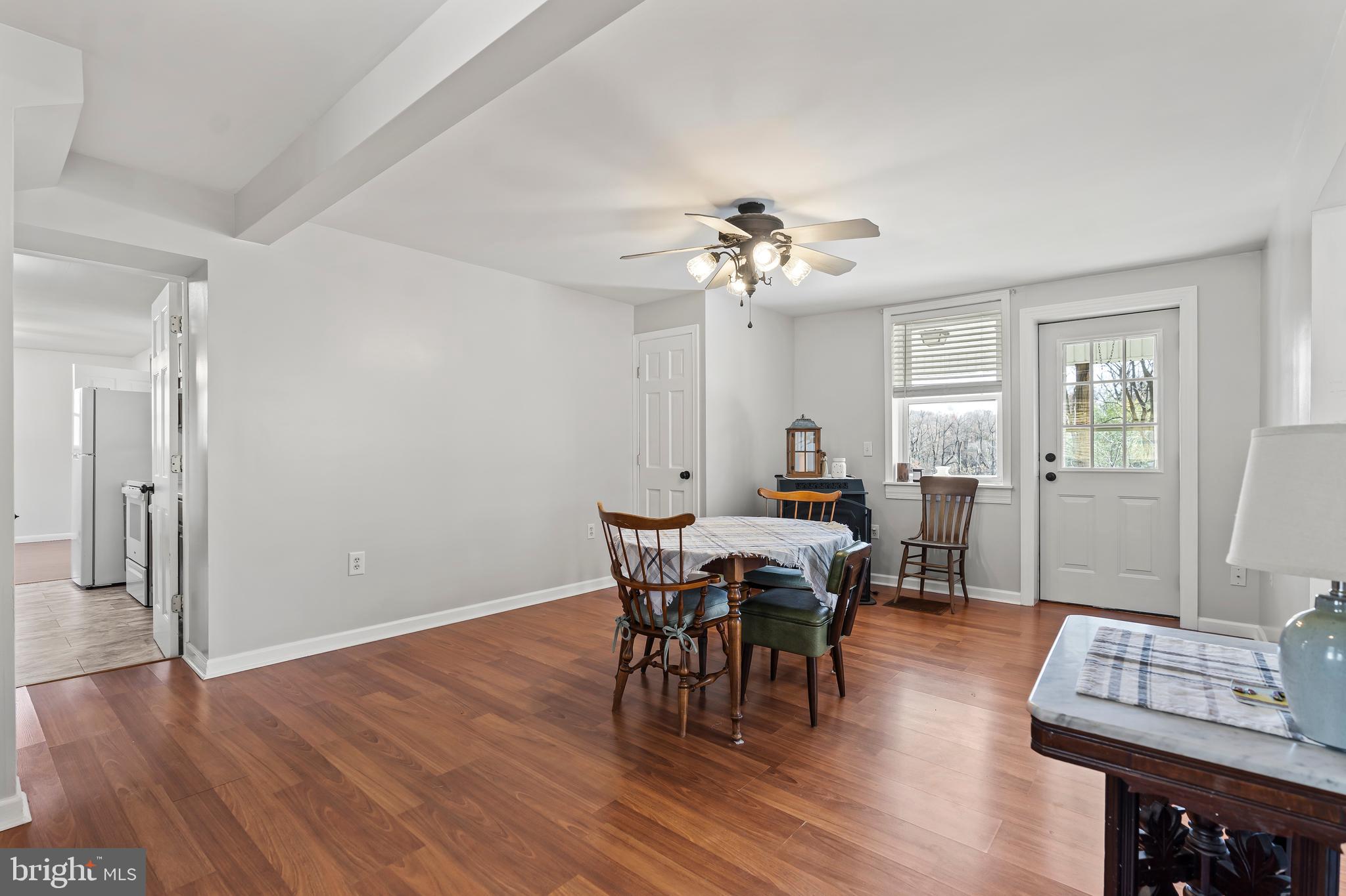 13608 Maryland Avenue Blue Ridge Summit, PA 17214 - Photo 20 of 80 a view of a dining room with furniture and wooden floor