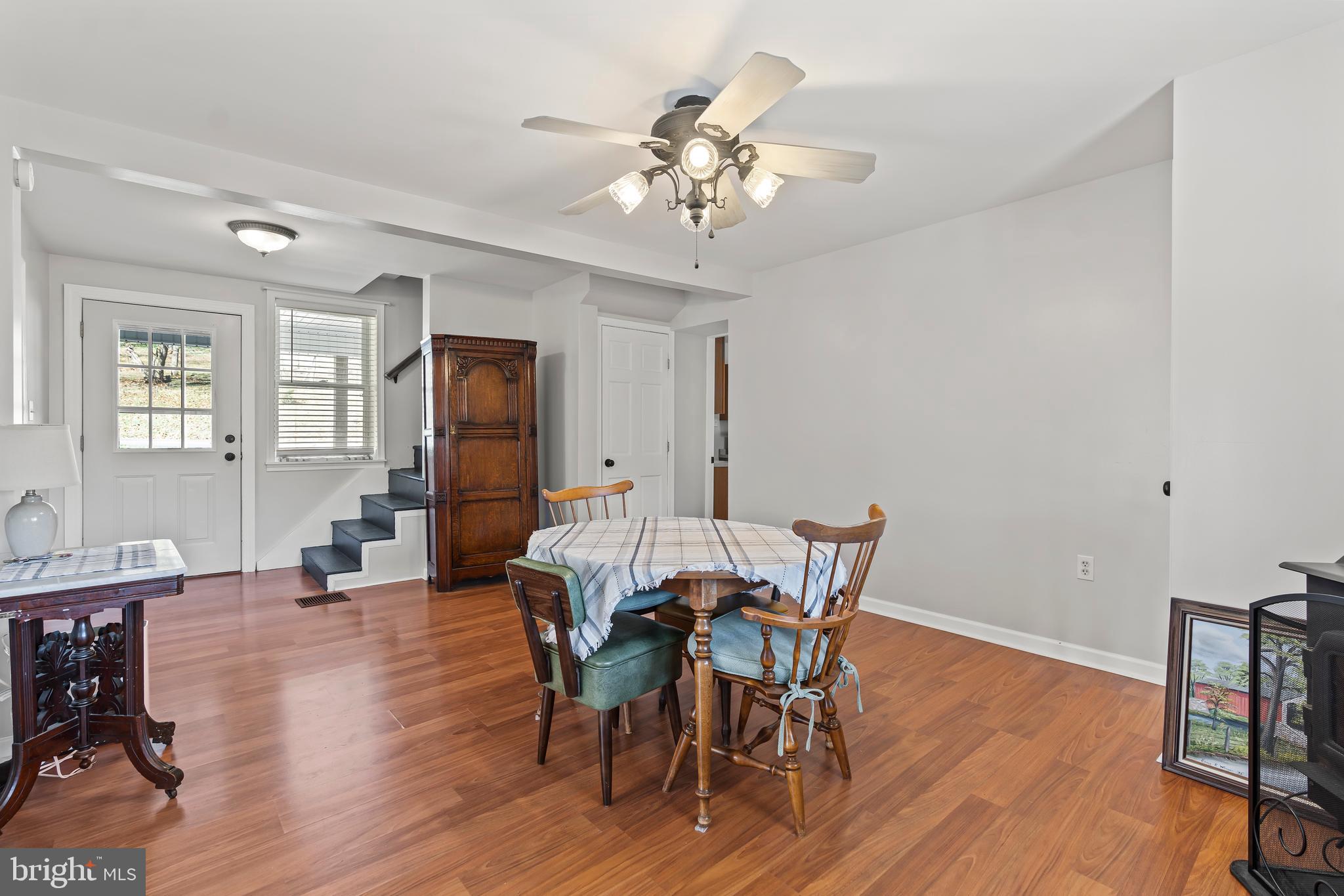 13608 Maryland Avenue Blue Ridge Summit, PA 17214 - Photo 22 of 80 a view of a dining room with furniture and wooden floor