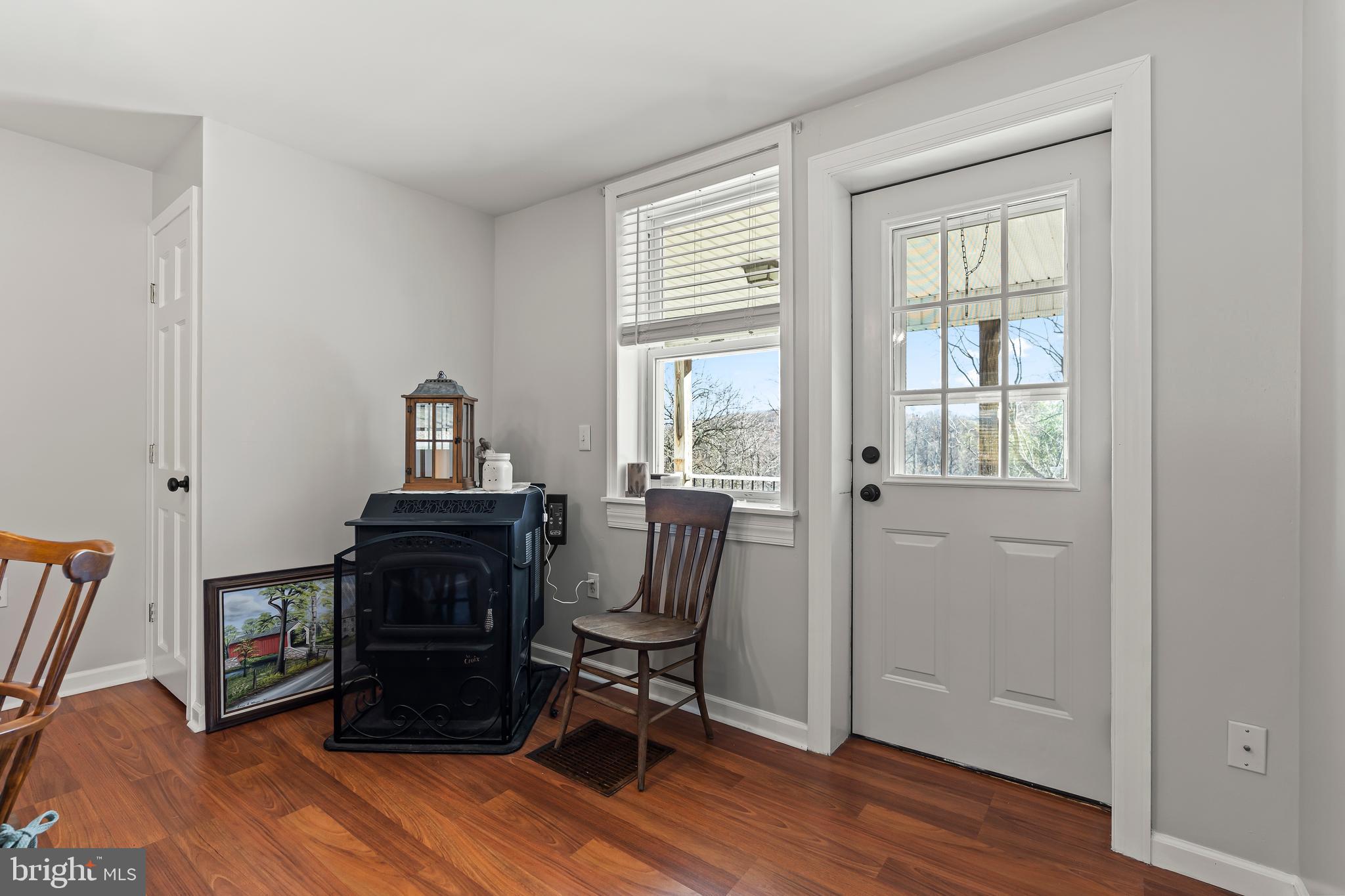 13608 Maryland Avenue Blue Ridge Summit, PA 17214 - Photo 23 of 80 a view of workspace with wooden floor windows