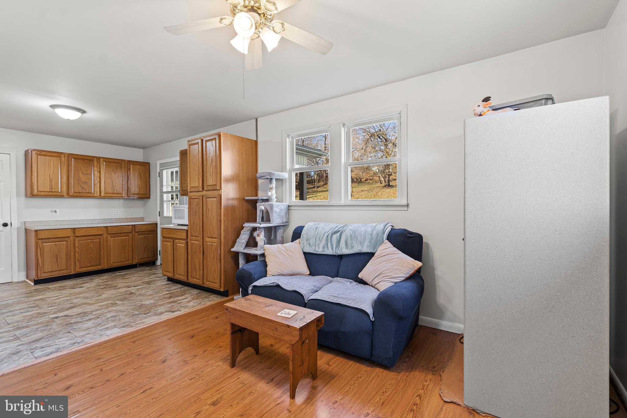 13608 Maryland Avenue Blue Ridge Summit, PA 17214 - Photo 30 of 80 a living room with furniture and a refrigerator