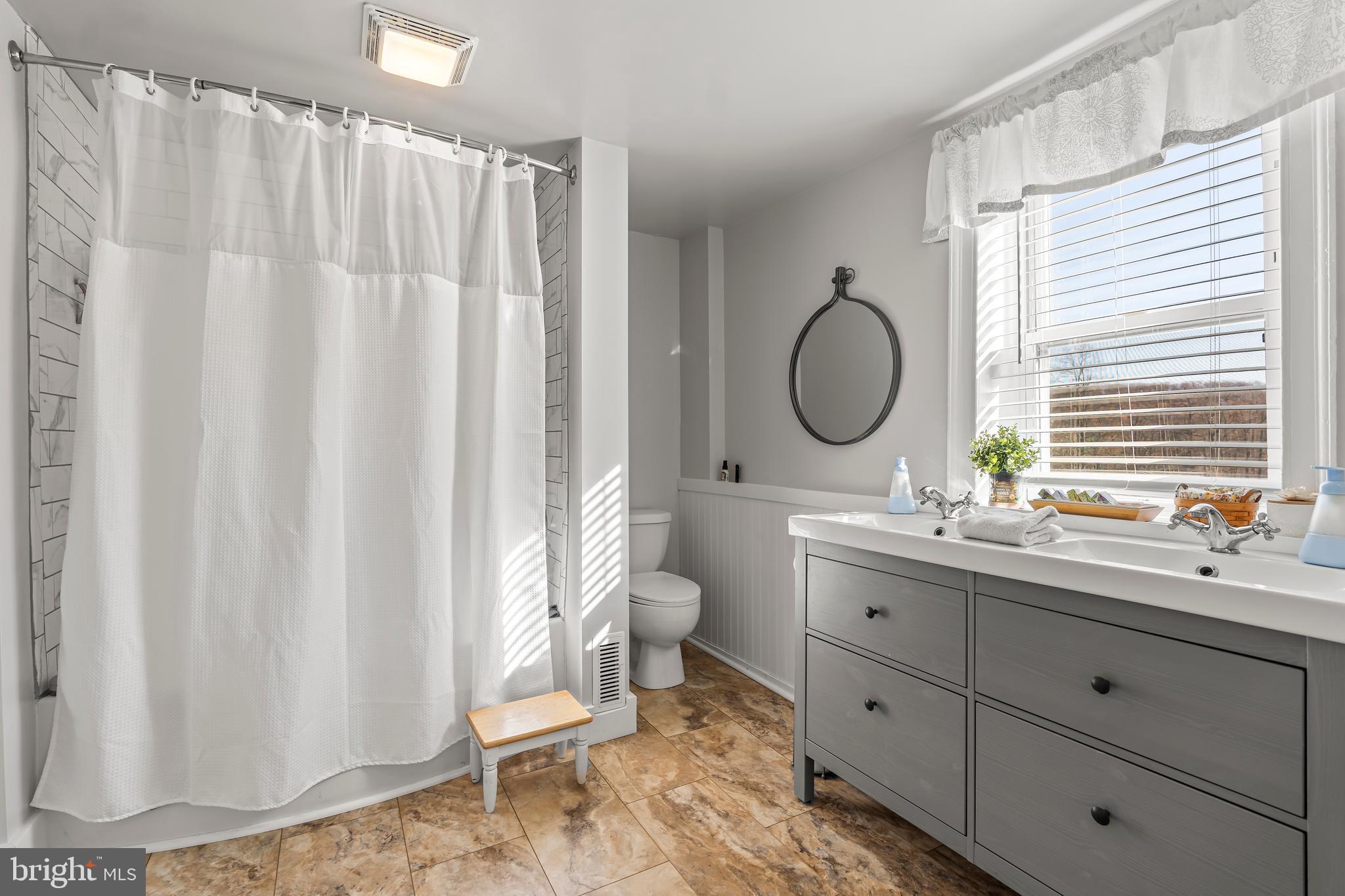 13608 Maryland Avenue Blue Ridge Summit, PA 17214 - Photo 41 of 80 a bathroom with a double vanity sink toilet mirror and