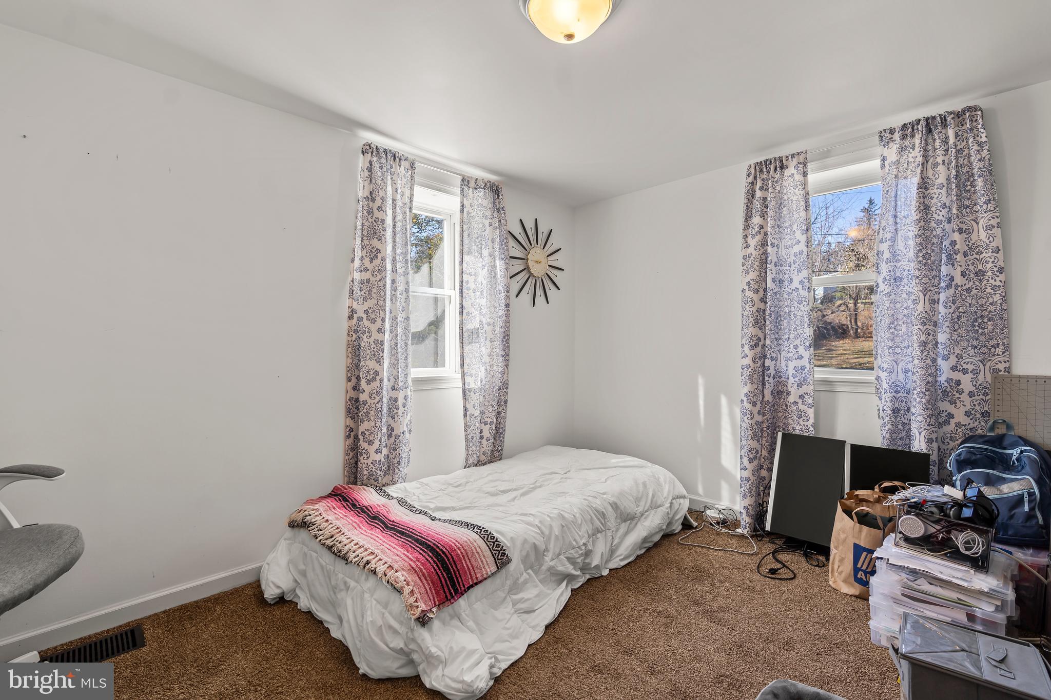 13608 Maryland Avenue Blue Ridge Summit, PA 17214 - Photo 49 of 80 a bedroom with a bed and a window