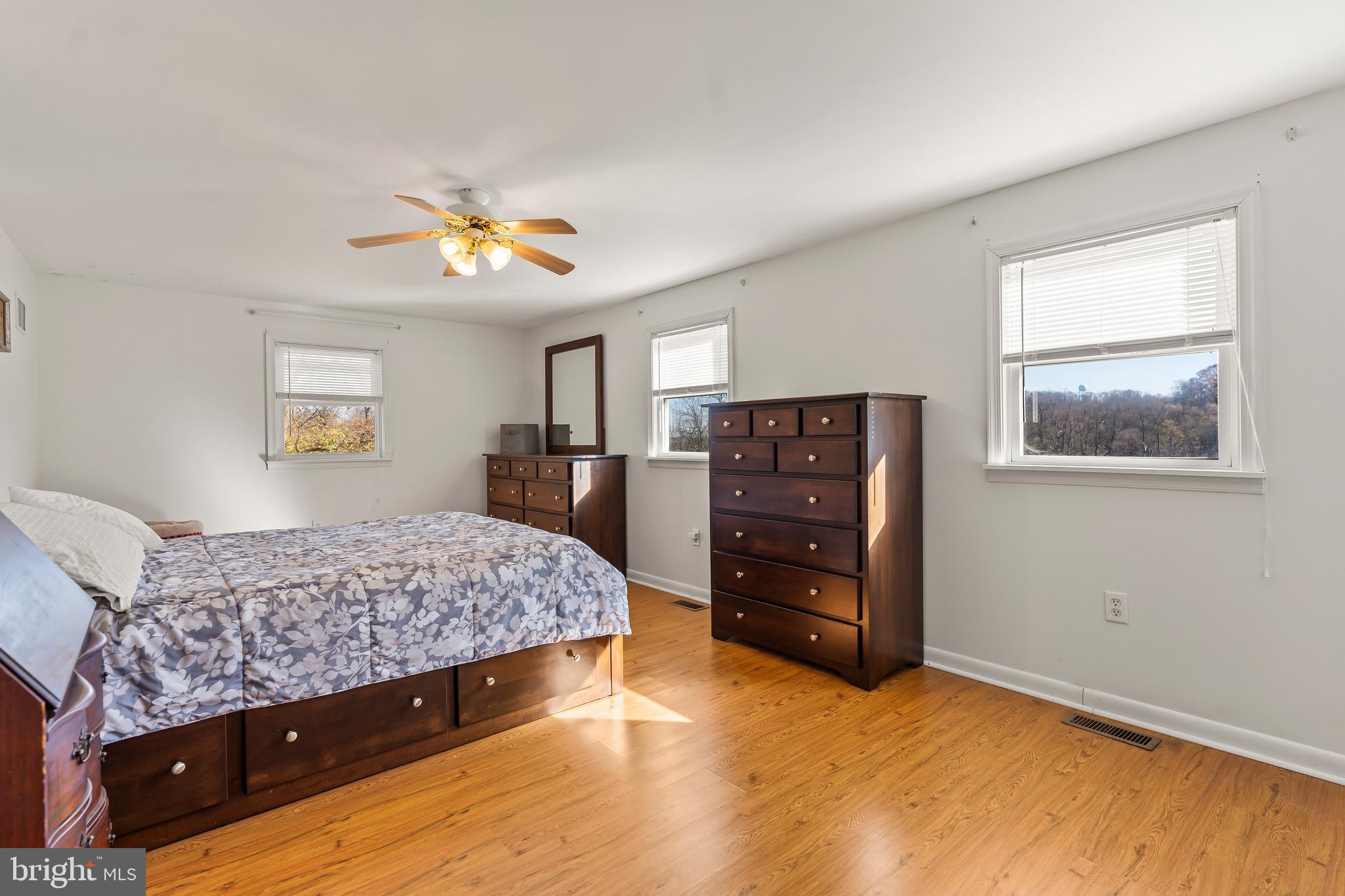 13608 Maryland Avenue Blue Ridge Summit, PA 17214 - Photo 50 of 80 a bedroom with a bed and a dresser