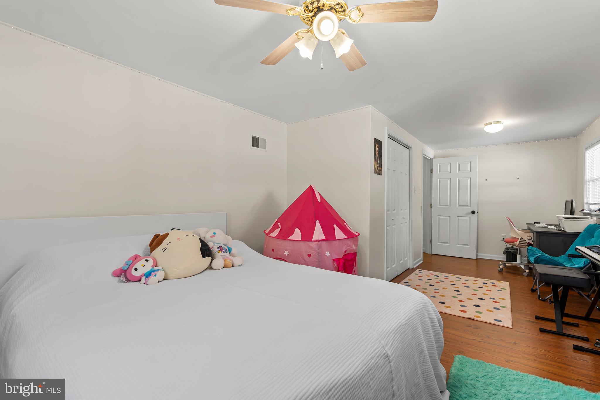 13608 Maryland Avenue Blue Ridge Summit, PA 17214 - Photo 53 of 80 a bedroom with a bed and a chandelier