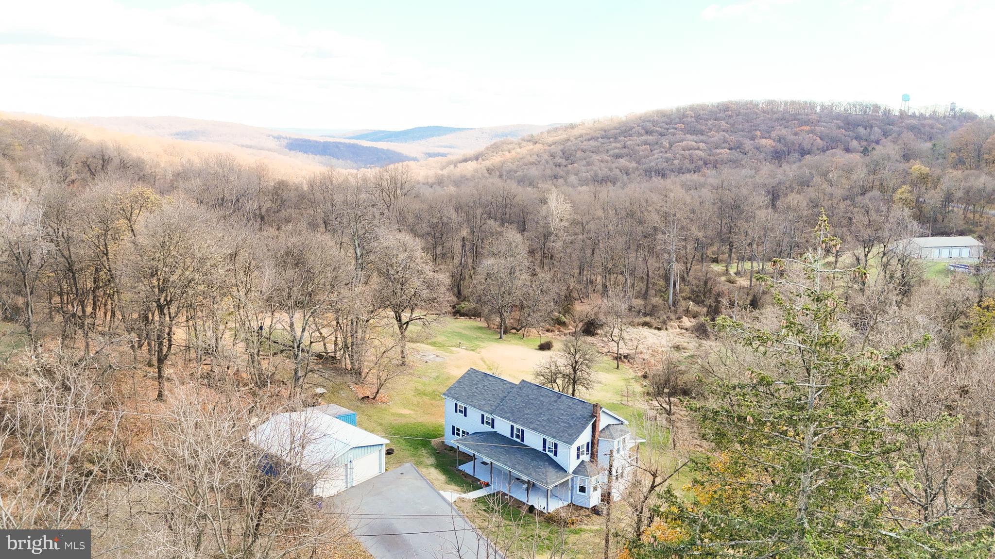 13608 Maryland Avenue Blue Ridge Summit, PA 17214 - Photo 63 of 80 an aerial view of house with yard and mountain view in back